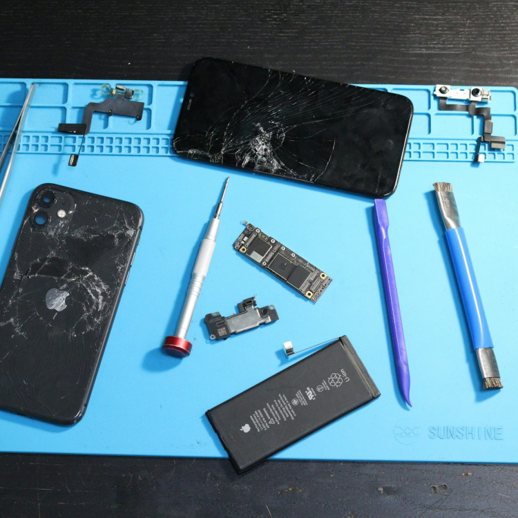 A broken phone disassembled for repair
