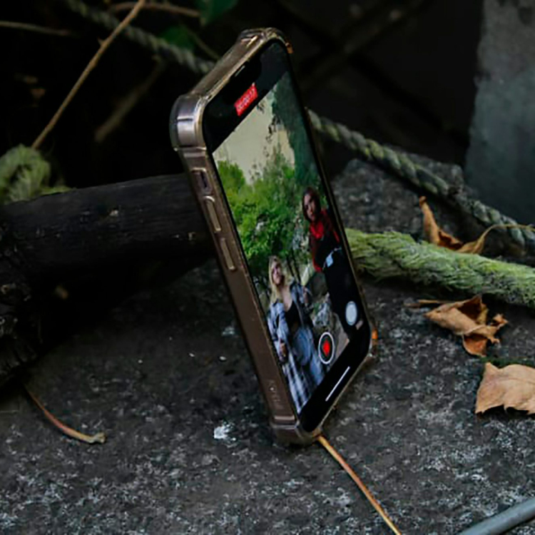 A cell phone sitting on top of a rock