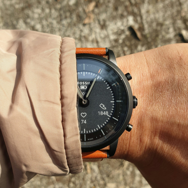 A close up of a person wearing a wrist watch