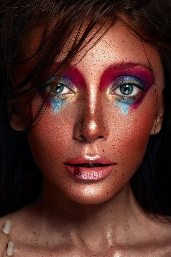 A close up of a woman with freckles on her face