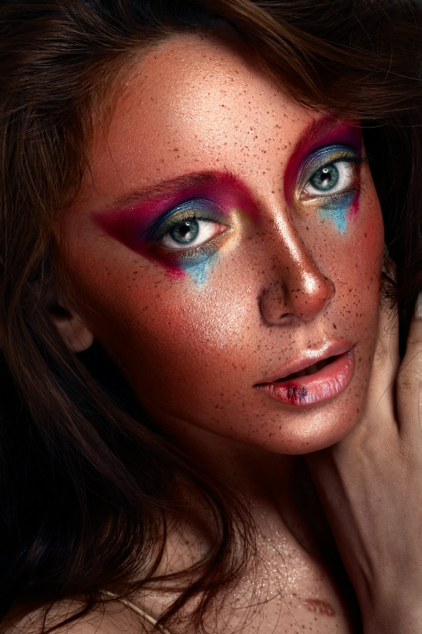 A close up of a woman with makeup