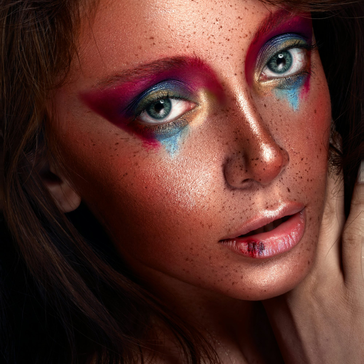 A close up of a woman with makeup