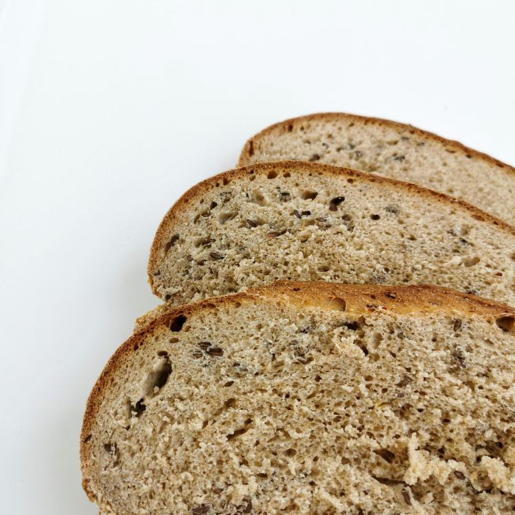 A close up of slices of bread on a white surface