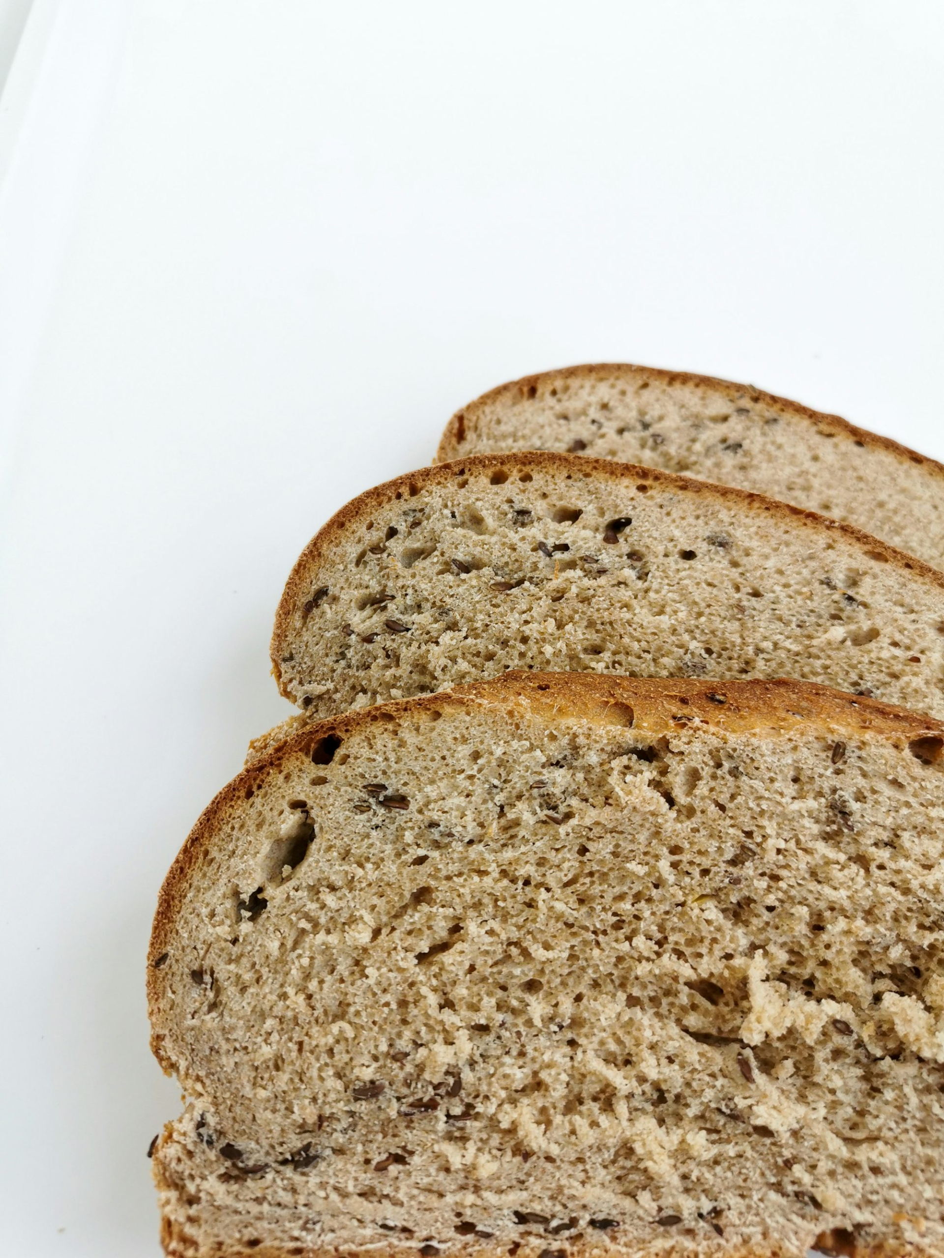 A close up of slices of bread on a white surface