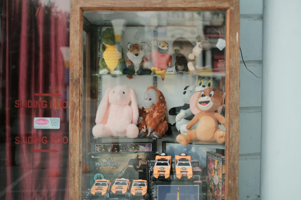 A display case filled with lots of stuffed animals