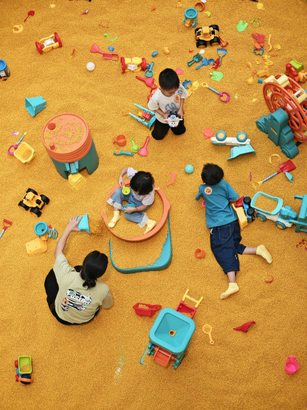 A group of children playing in a play area