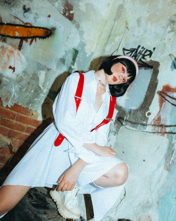 A person sitting on a wall