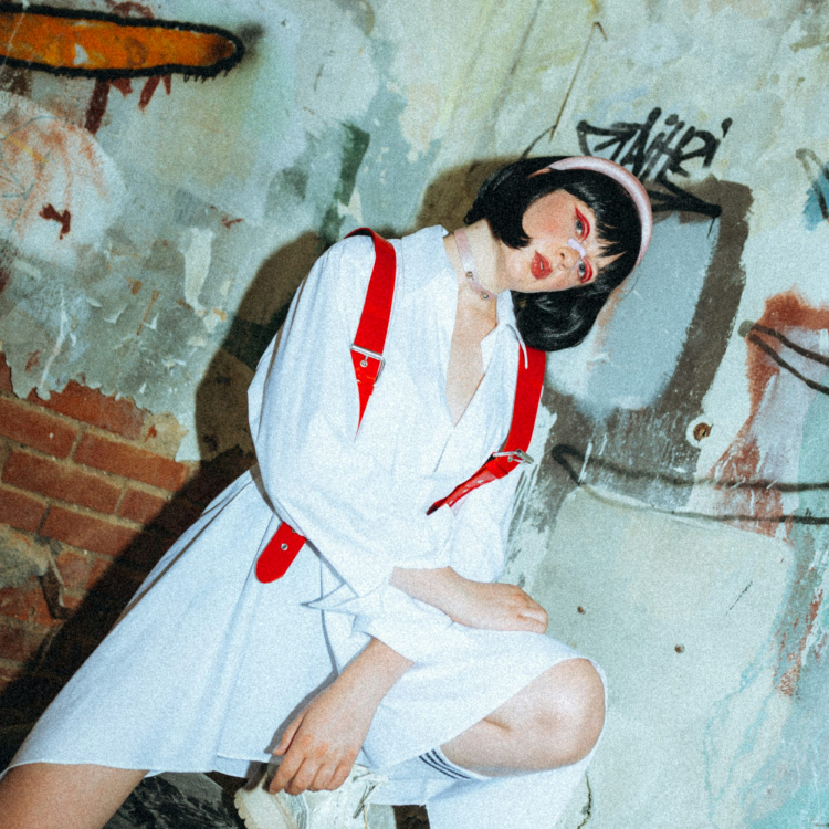 A person sitting on a wall