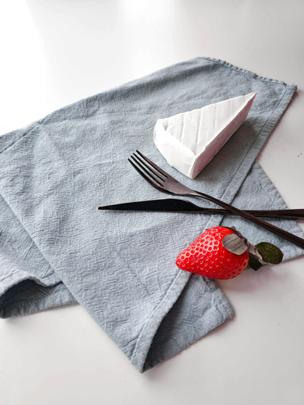 A piece of cake sitting on top of a napkin