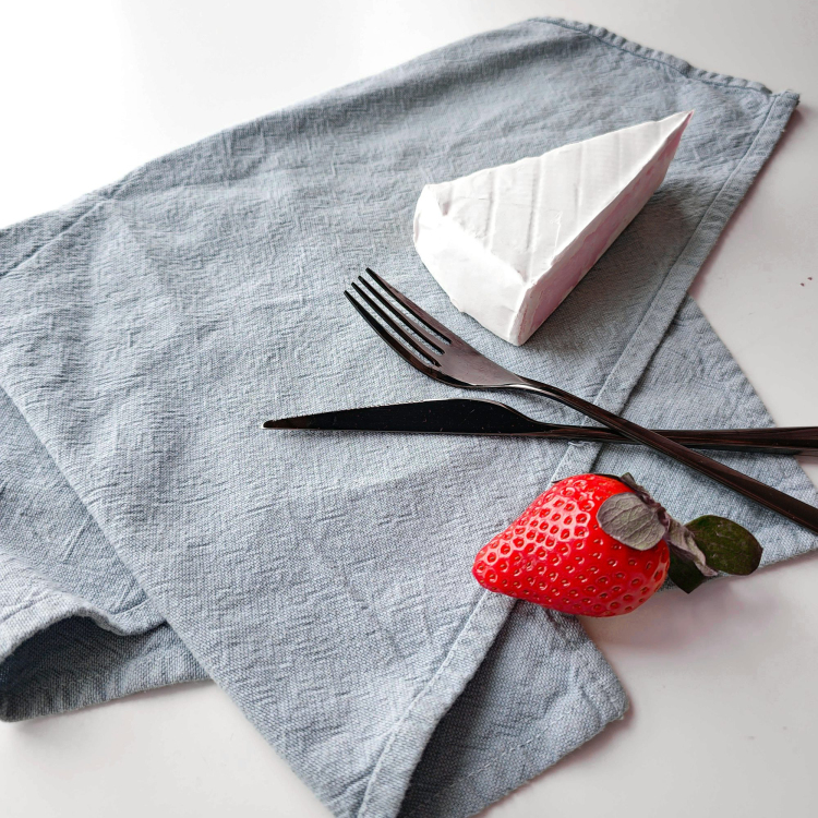 A piece of cake sitting on top of a napkin