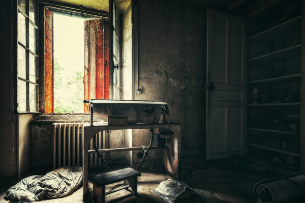 A room with a chair and a window
