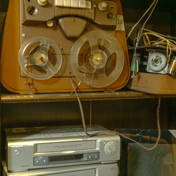 A shelf with a bunch of electronics on top of it