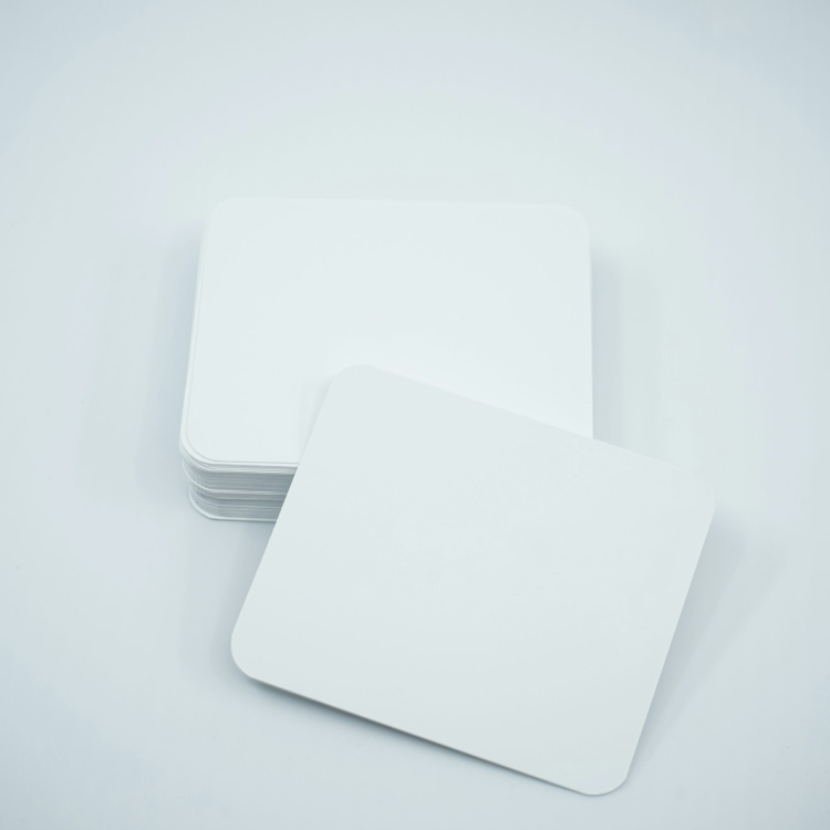 A stack of white cards sitting on top of each other