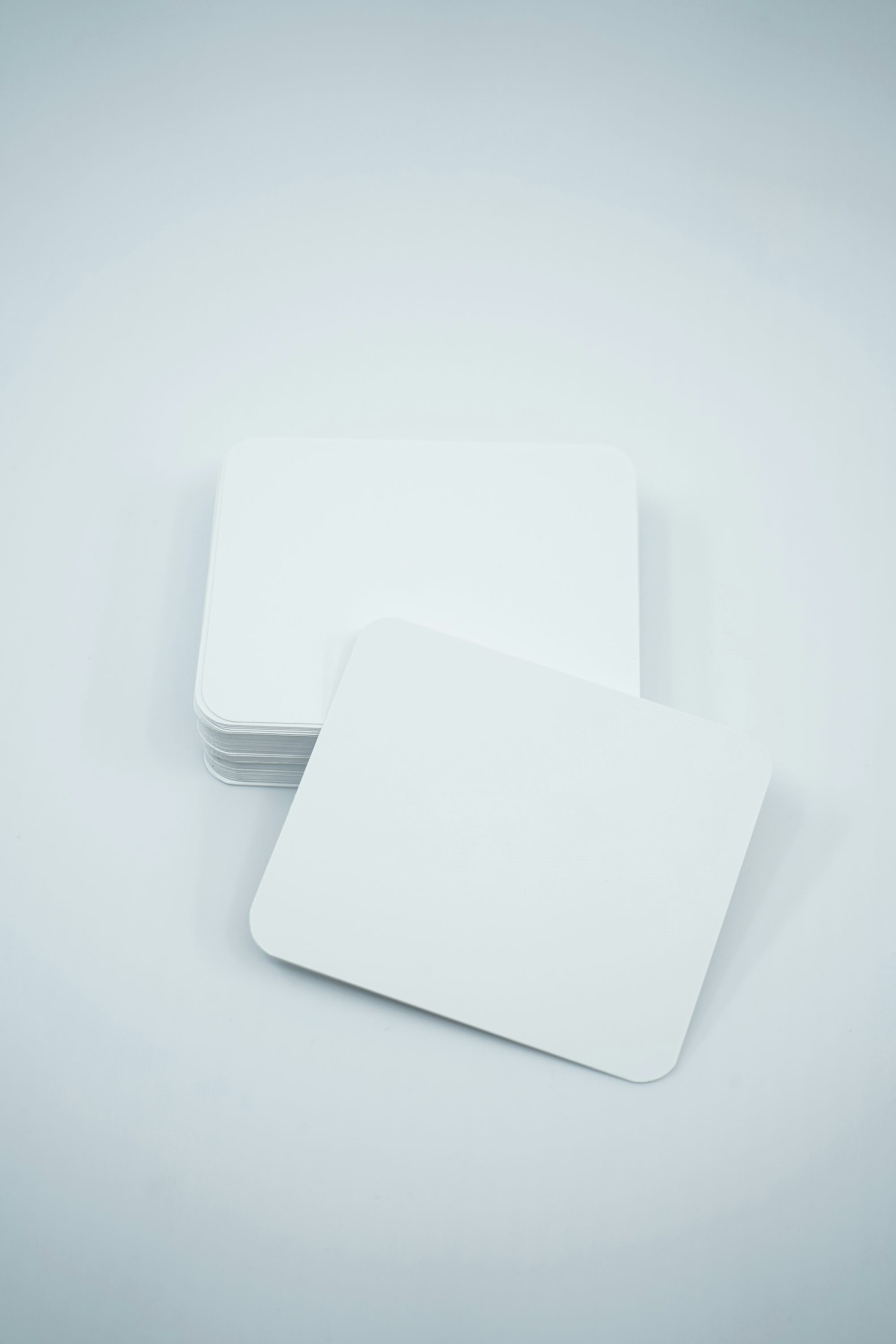 A stack of white cards sitting on top of each other