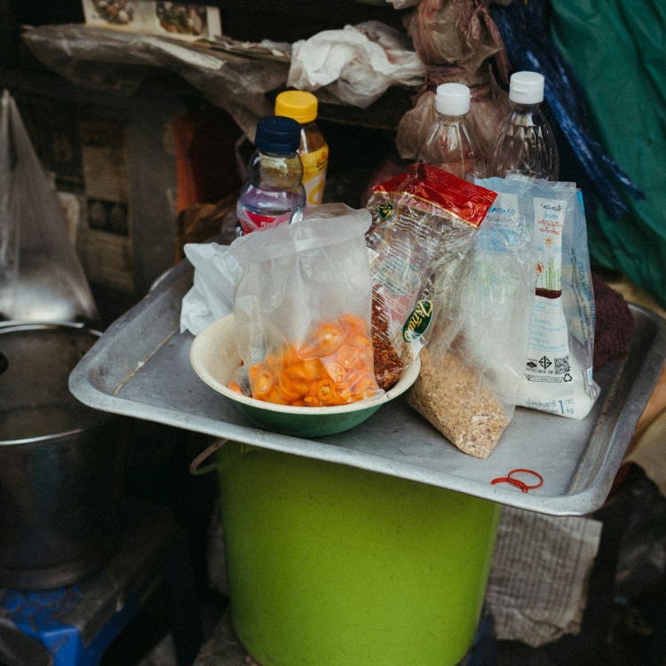 A table with a bowl of food on top of it