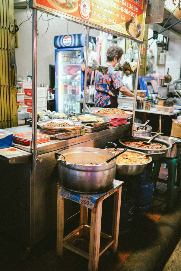 A woman preparing food in a restaurant kitchen