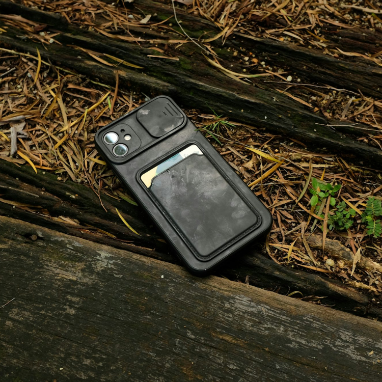 An old cell phone laying on the ground