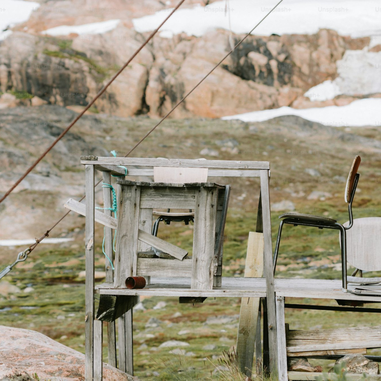 An outdoor set up with a wooden ladder and chair