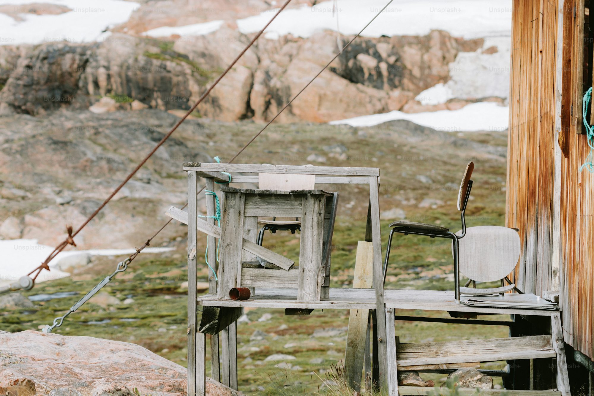 An outdoor set up with a wooden ladder and chair