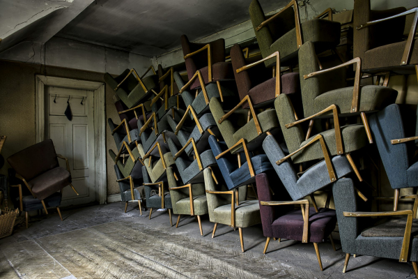 Assorted armchair on wall near door