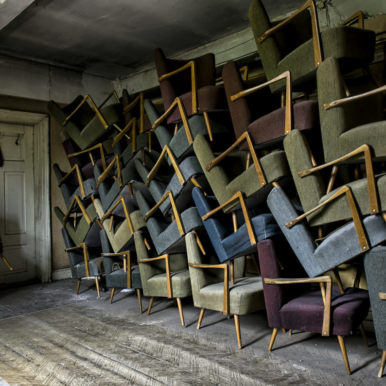 Assorted armchair on wall near door