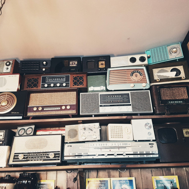 Assorted radio collection on rack