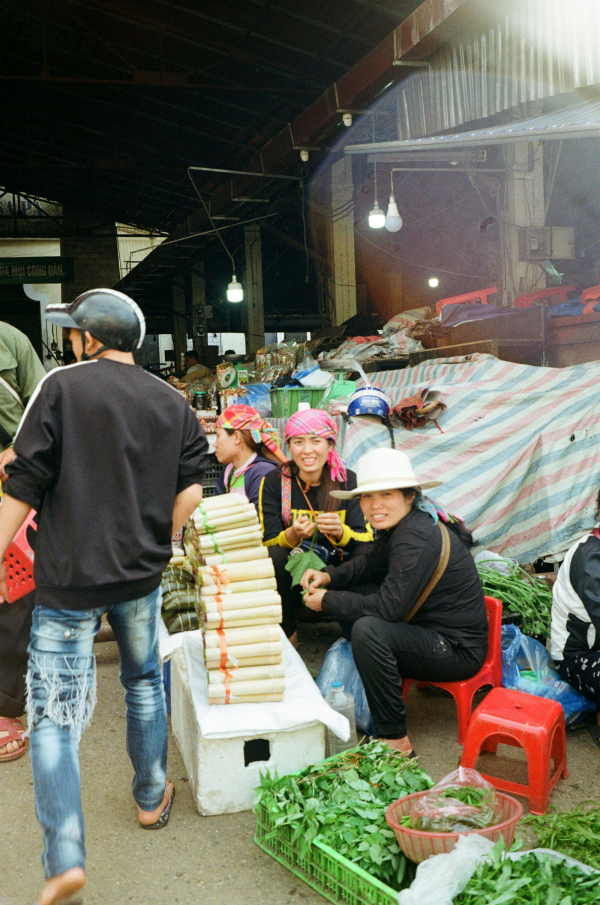 People are at a bustling outdoor market