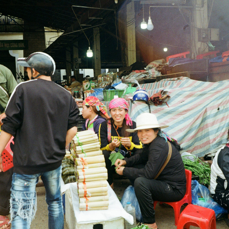 People are at a bustling outdoor market