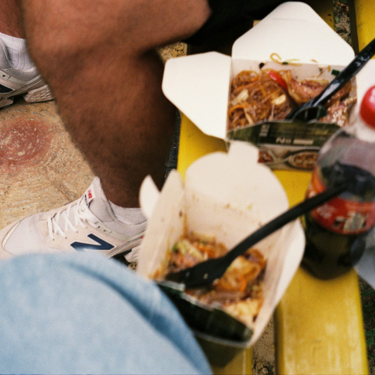 Person in white nike sneakers