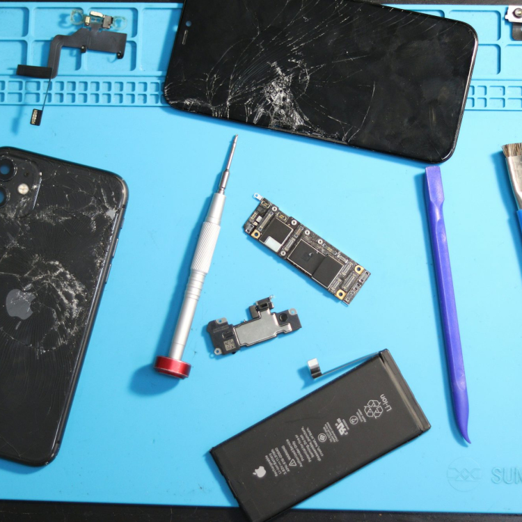Phone parts scattered on a repair mat