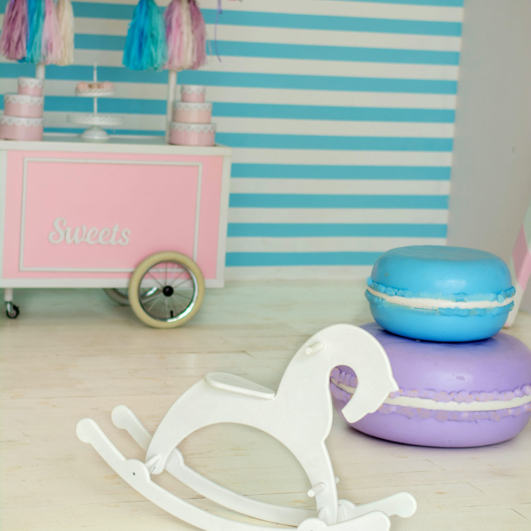 Pink and white wooden rocking horse