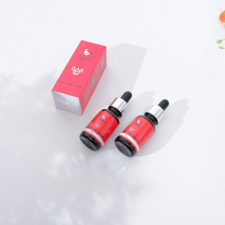 Red and black bottles on white surface