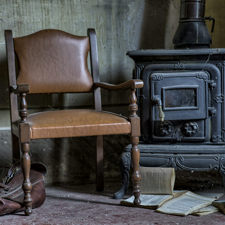 Two black leather padded chairs