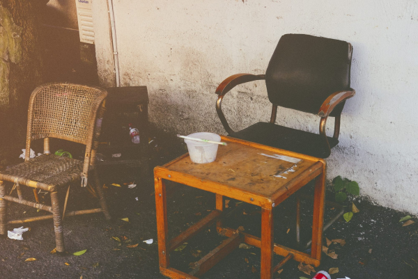 Two chairs and a table in front of a wall