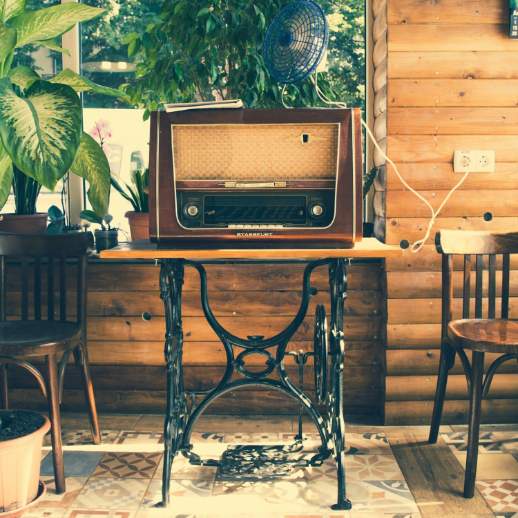 Vointage brown radio on black wooden table