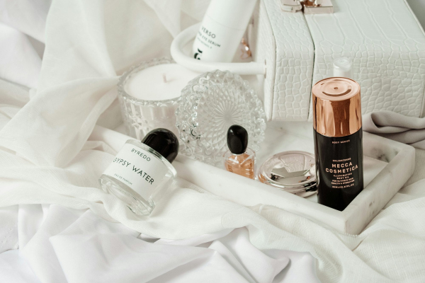 White and brown plastic bottle on white textile