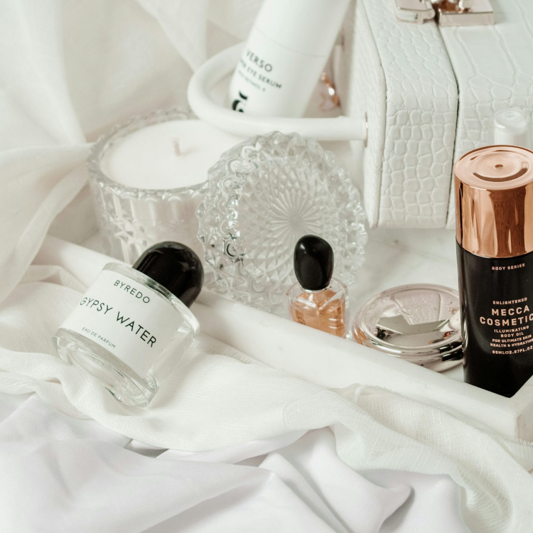 White and brown plastic bottle on white textile