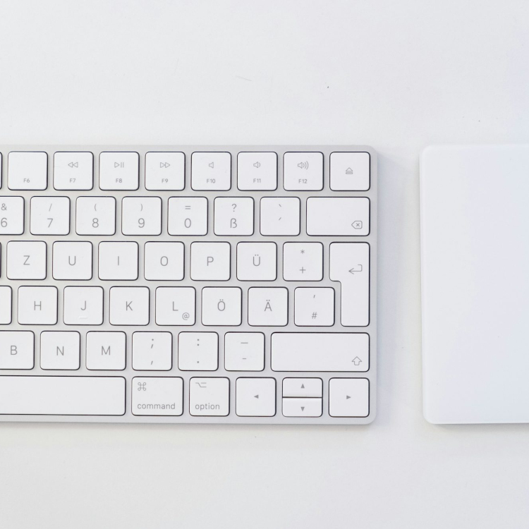 White apple keyboard on white table