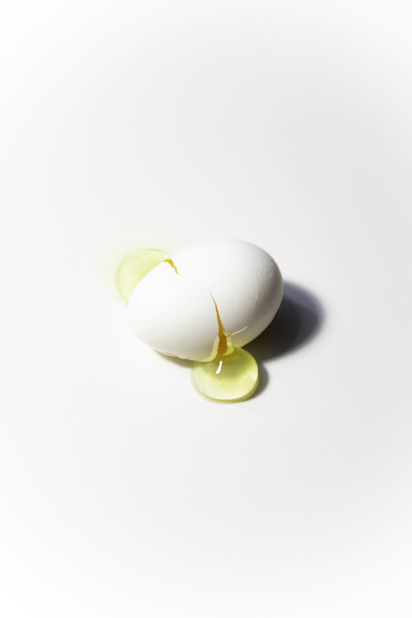 White egg on white surface