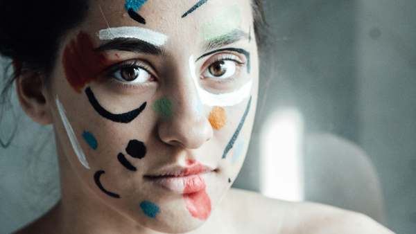 Woman with blue and black face paint