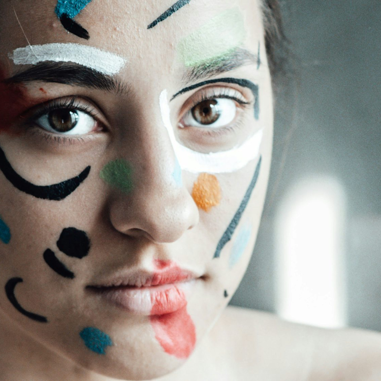 Woman with blue and black face paint