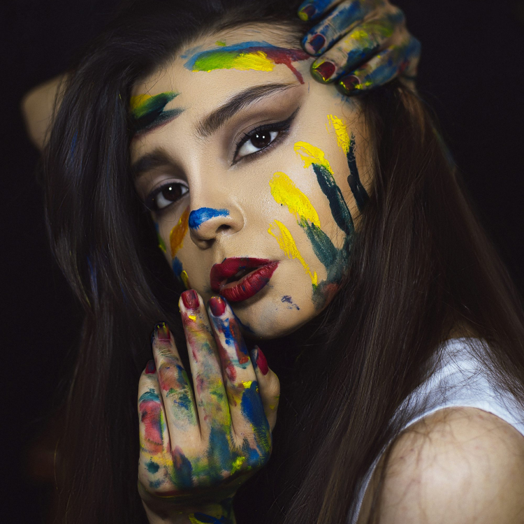 Woman with red blue and yellow face paint