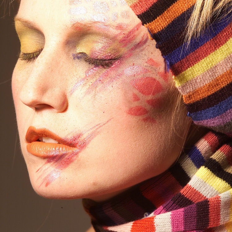 Woman with red white and black face paint